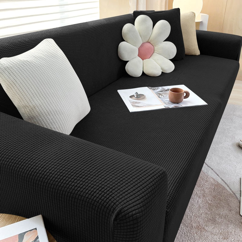 Housse de canapé extensible beige avec motif élégant et design antidérapant, disponible en plusieurs tailles pour salons mode