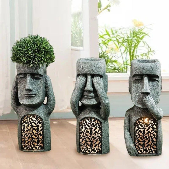 Jardinière solaire LED sculpturale décorative. Éclairage extérieur élégant.