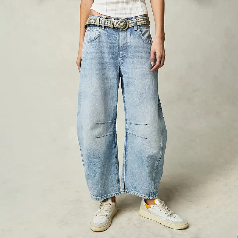 Jean large femme élégant, confort coton doux, coupe flatteuse, coloris bleu, style moderne polyvalent pour toutes occasions.