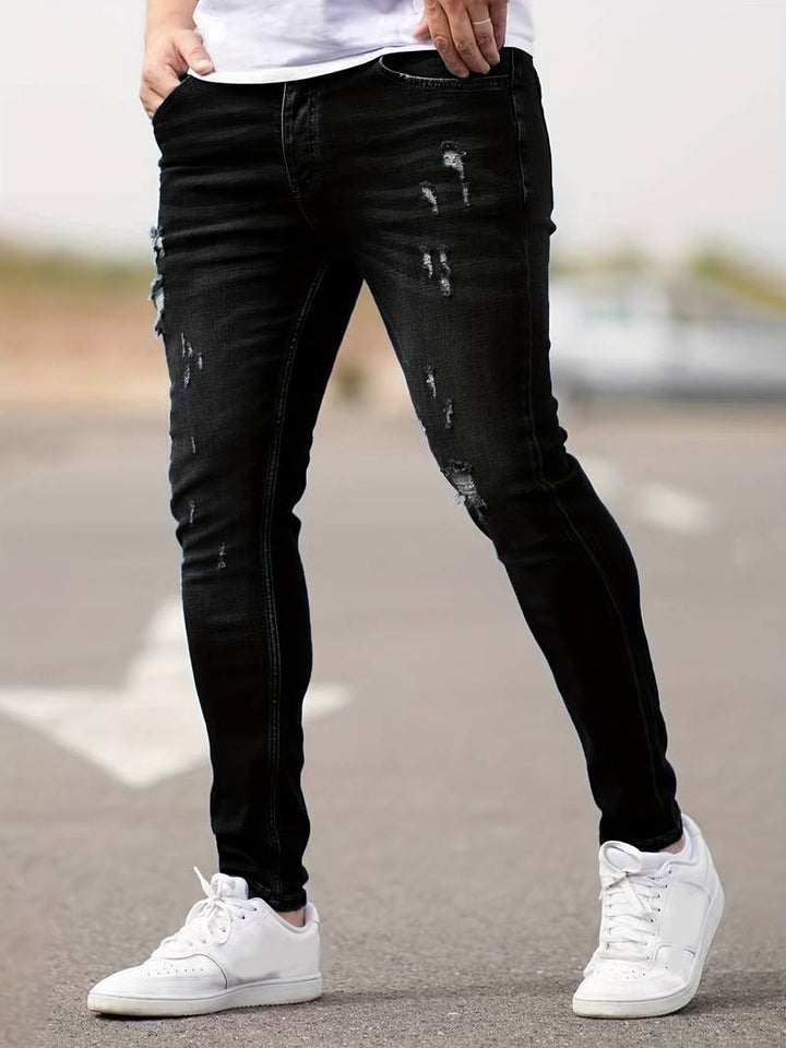 Pantalon homme en jean slim-fit stretch, conception moderne et grande souplesse.