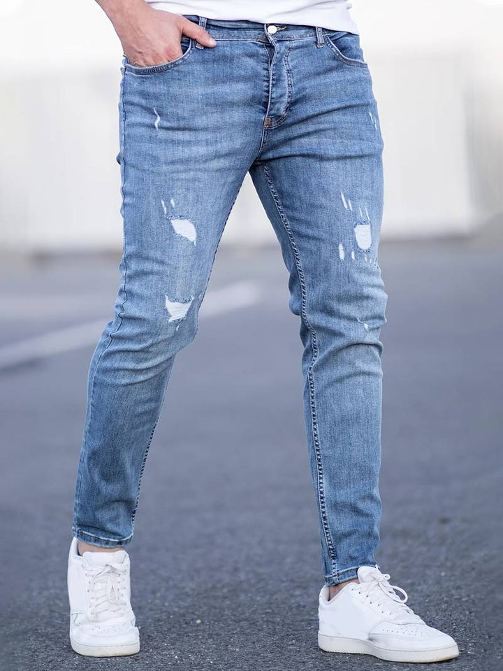 Jeans slim-fit homme, coupe ajustée, denim stretch, pour un look tendance et aisé.