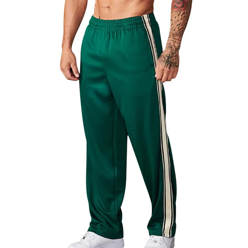 Jogging homme coupe relax, confort ultime.  Modèle décontracté, idéal pour la détente.