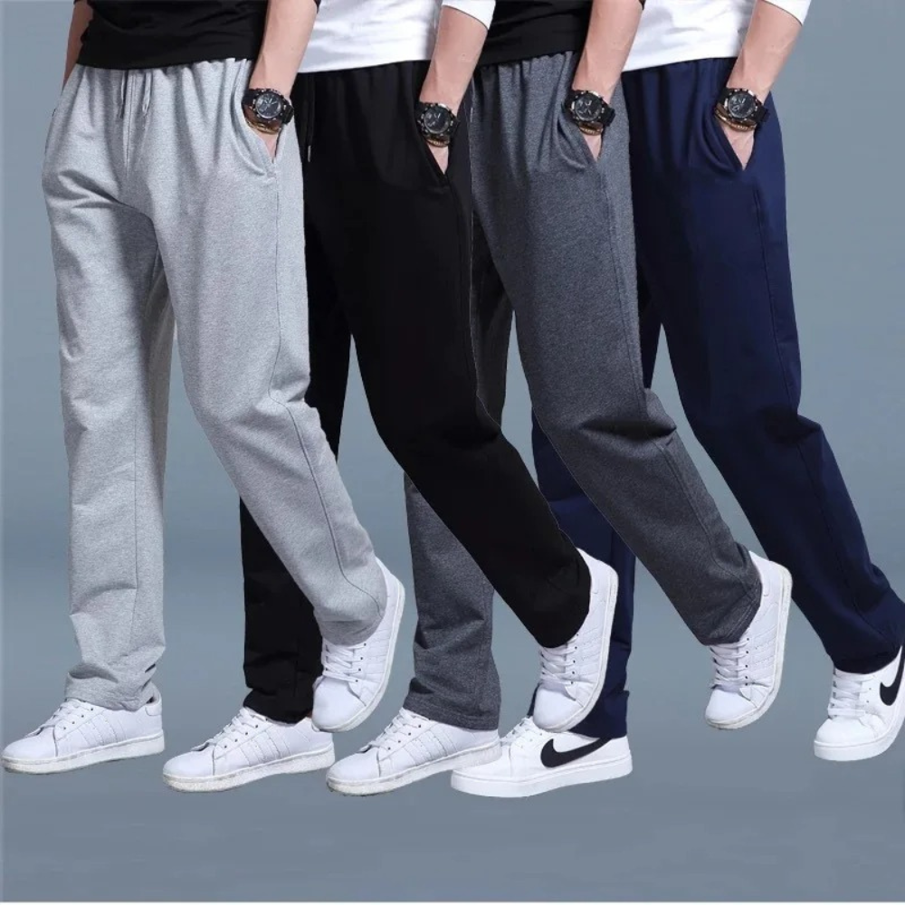 Jogging homme noir, coupe moderne et confortable, idéal pour le sport et la détente.