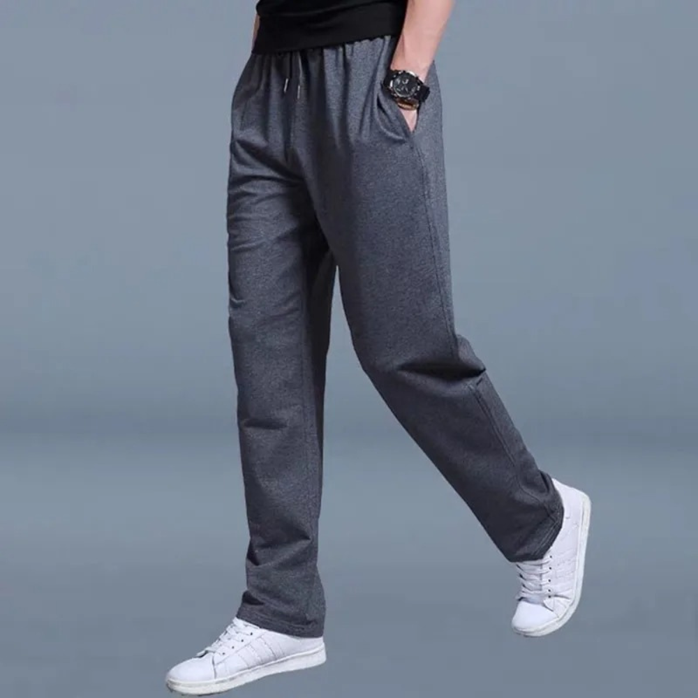 Pantalon de sport homme confortable, coupe contemporaine pour la gym ou la maison.