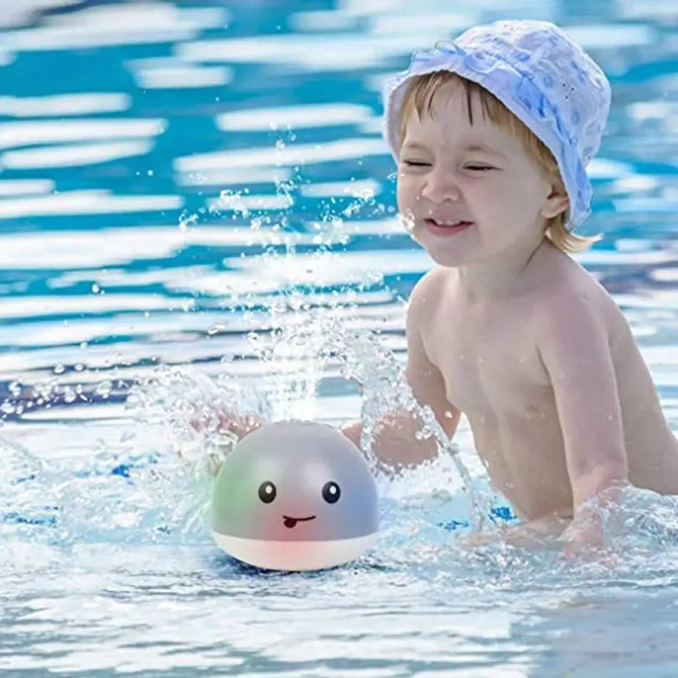 Jouet bain bébé: baleine avec jet d'eau LED.  Amusant et coloré.