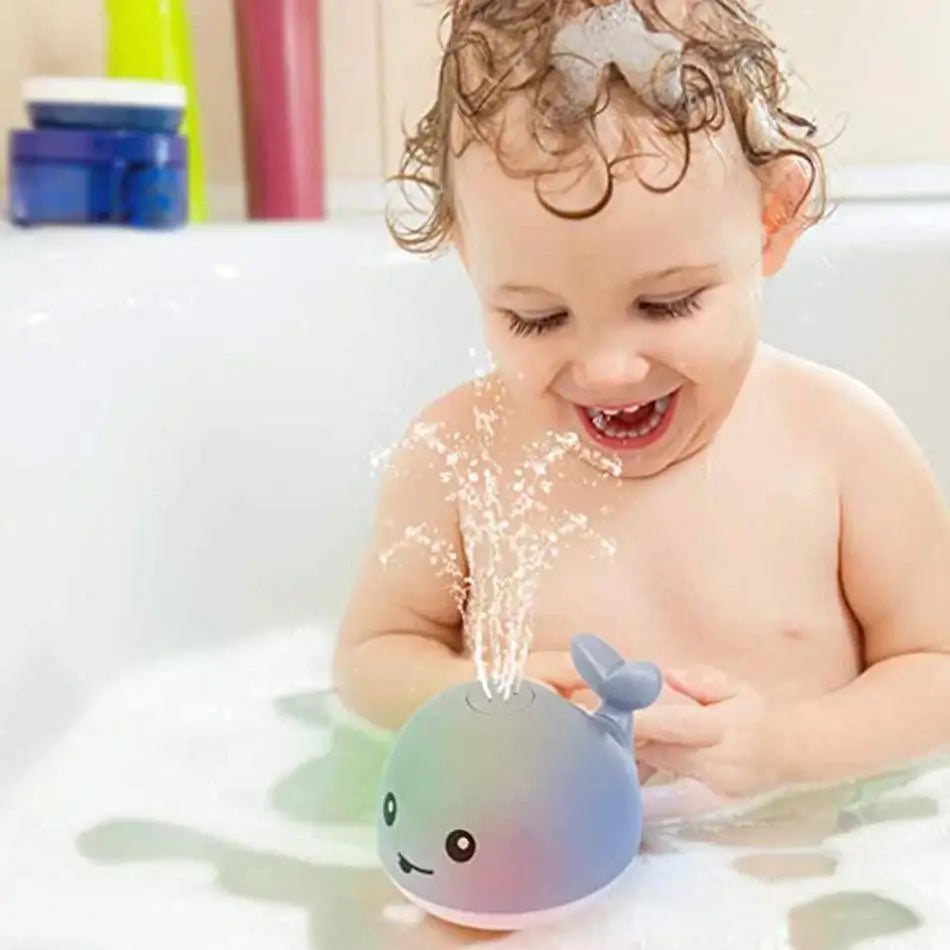Jouet bain bébé: baleine avec jet d'eau LED.  Amusant et coloré.