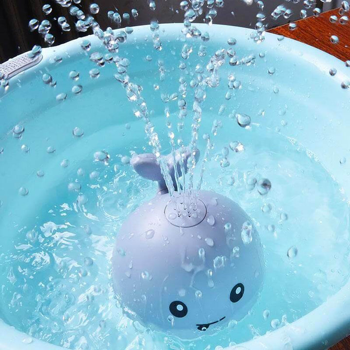 Jouet bain bébé: baleine avec jet d'eau LED.  Amusant et coloré.