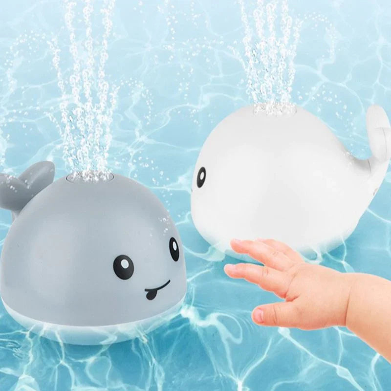Jouet bain bébé: baleine avec jet d'eau LED.  Amusant et coloré.