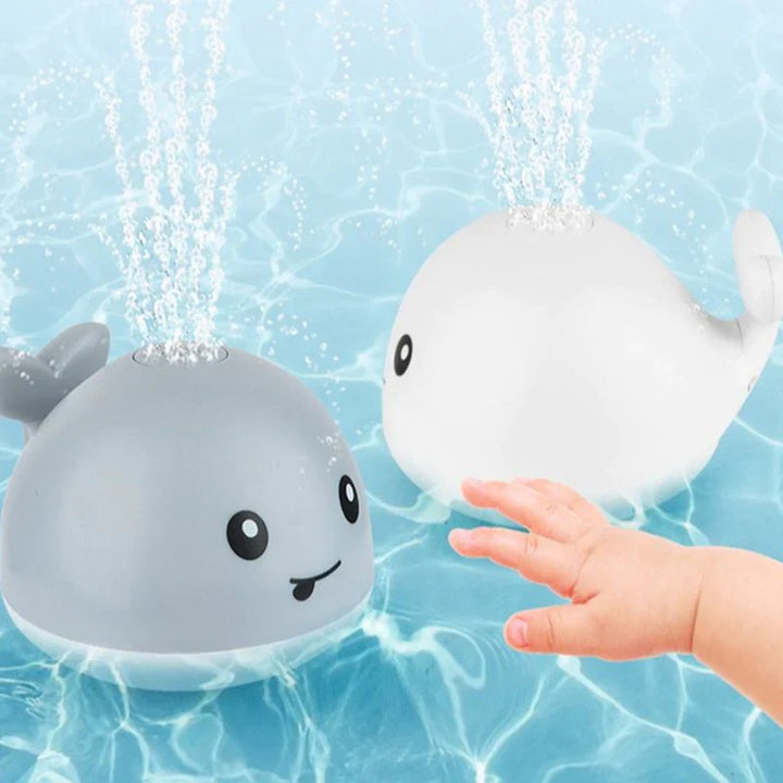 Jouet bain bébé: baleine avec jet d'eau LED.  Amusant et coloré.