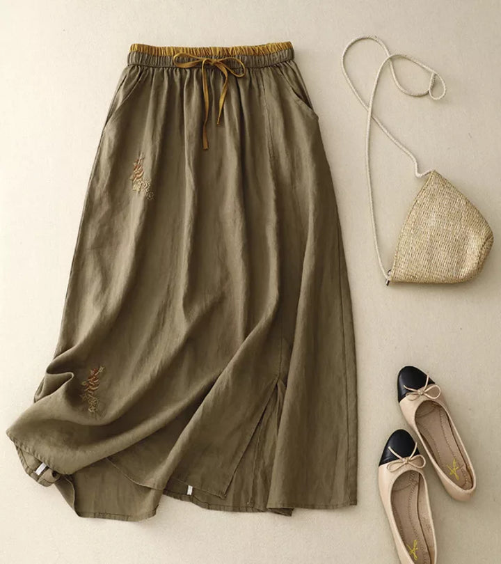 Jupe femme taille haute A-line avec poches. Style élégant et décontracté, parfaite pour l'été.