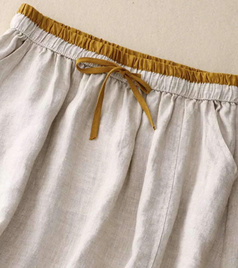 Détail d'une jupe femme A-line mi-longue à broderie. Taille haute, style décontracté chic d'été.