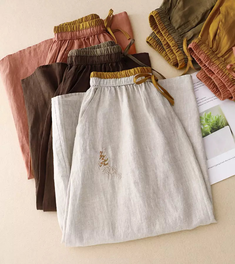 Femme portant une jupe midi A-line taille haute. Look estival élégant, fluide et très confortable.