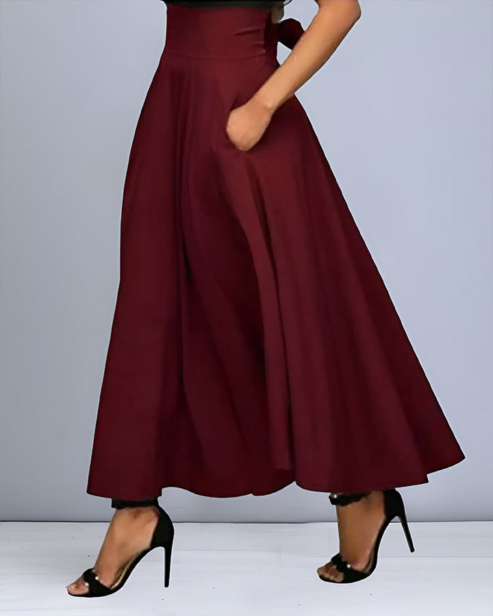 Jupe longue élégante femme, mode automne chic. Jupe fluide maxi pour une tenue décontractée ou habillée.