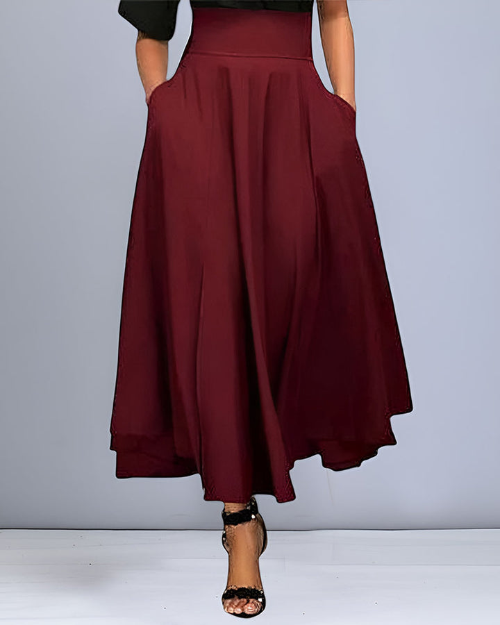 Femme stylée en jupe longue maxi automne. Jupe élégante pour un look chic et décontracté, parfaite pour la mode femme.