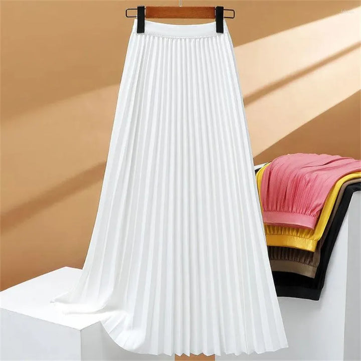 Jupe plissée longue taille haute femme. Chic et tendance, cette jupe extensible est idéale pour la mode printemps-été.