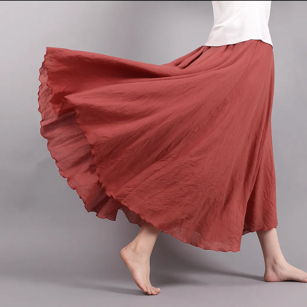 Jupe plissée Vera, longue et fluide, conçue pour femme, parfaite pour un style polyvalent.