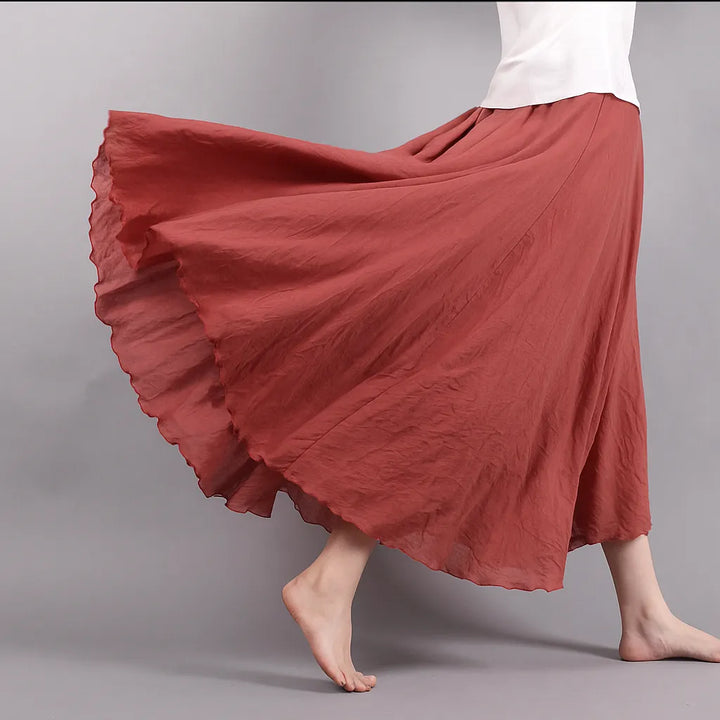 Jupe plissée Vera, longue et fluide, conçue pour femme, parfaite pour un style polyvalent.