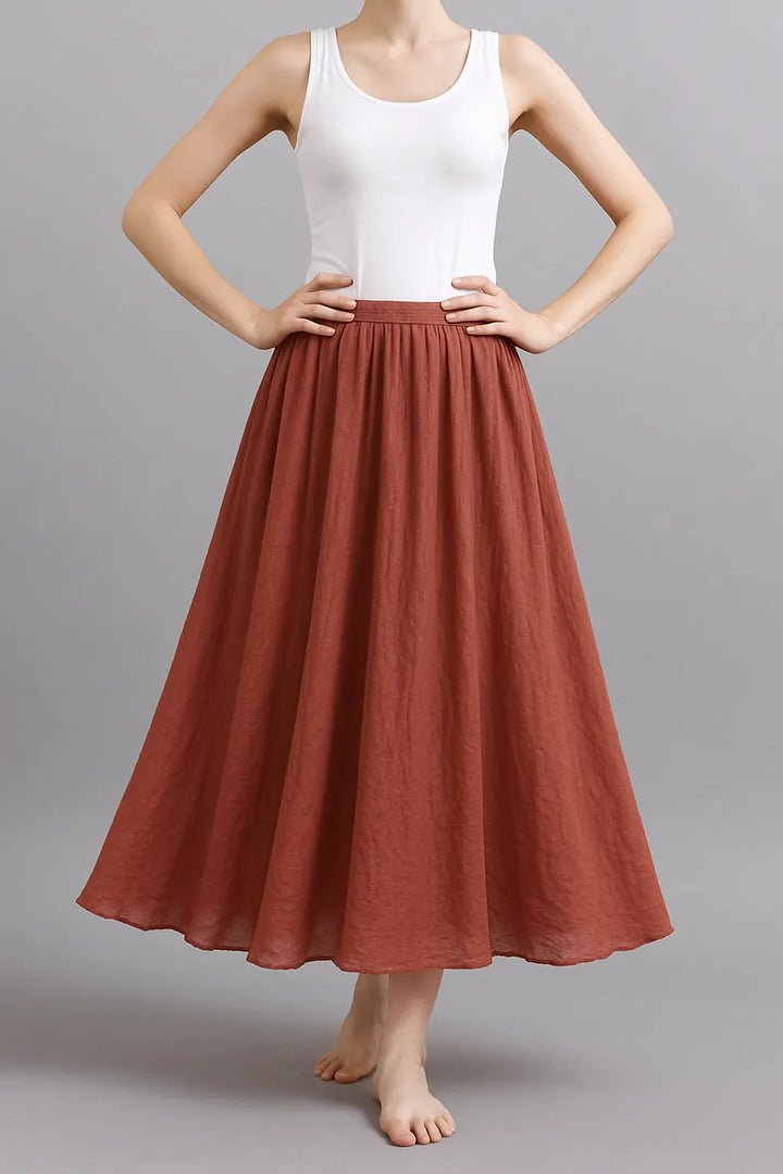 Élégante jupe plissée longue Vera, style bohème-chic, parfait pour la garde-robe femme.
