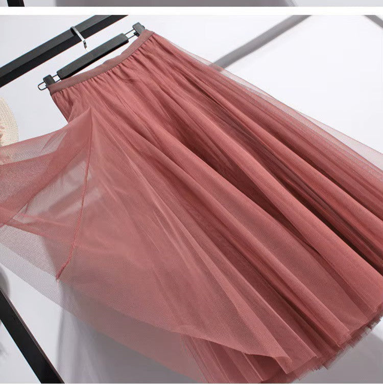 Jupe longue évasée femme, taille haute. Jupe midi/maxi romantique et fluide, parfaite pour le printemps-été.