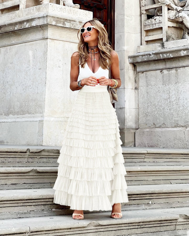 Confortable jupe longue femme avec taille élastique, style évasé fluide, idéale pour l'été décontracté chic.