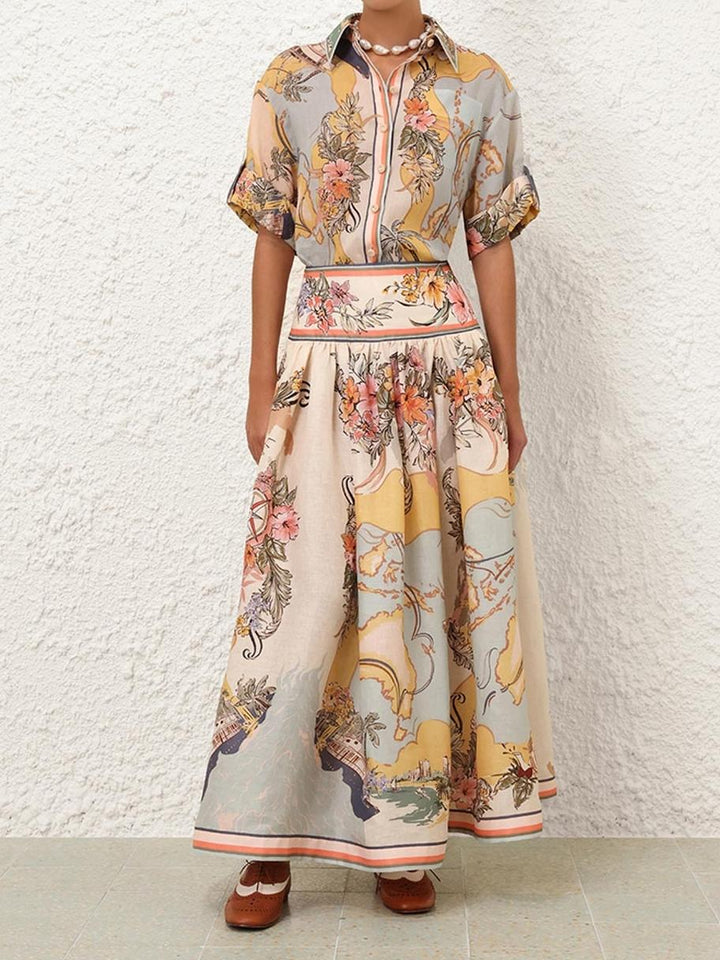 "Jupe midi Cindy élégante avec motifs floraux délicats pastel, charmante et féminine pour un look estival poétique."