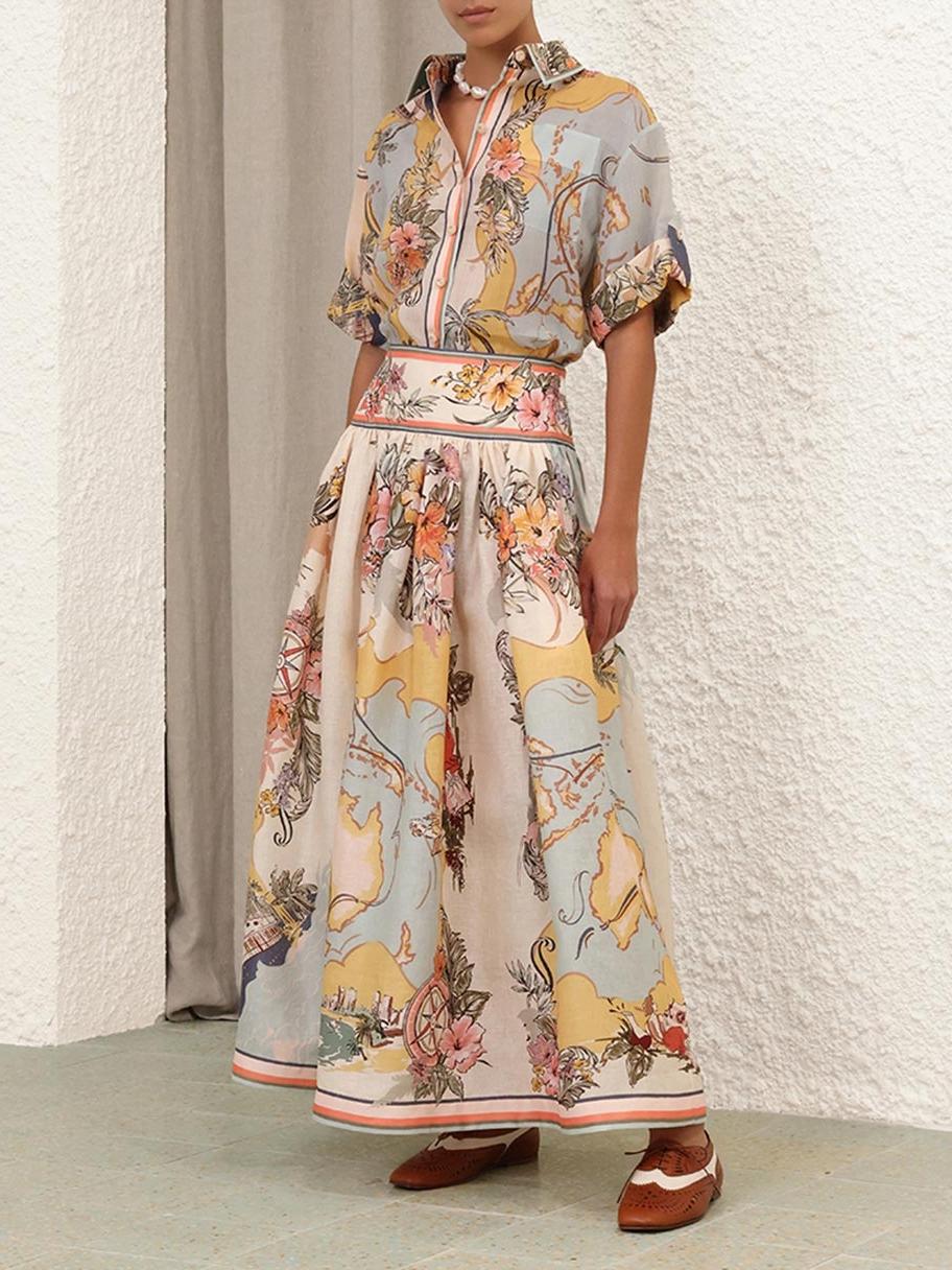 "Jupe midi Cindy élégante avec motifs floraux délicats pastel, charmante et féminine pour un look estival poétique."