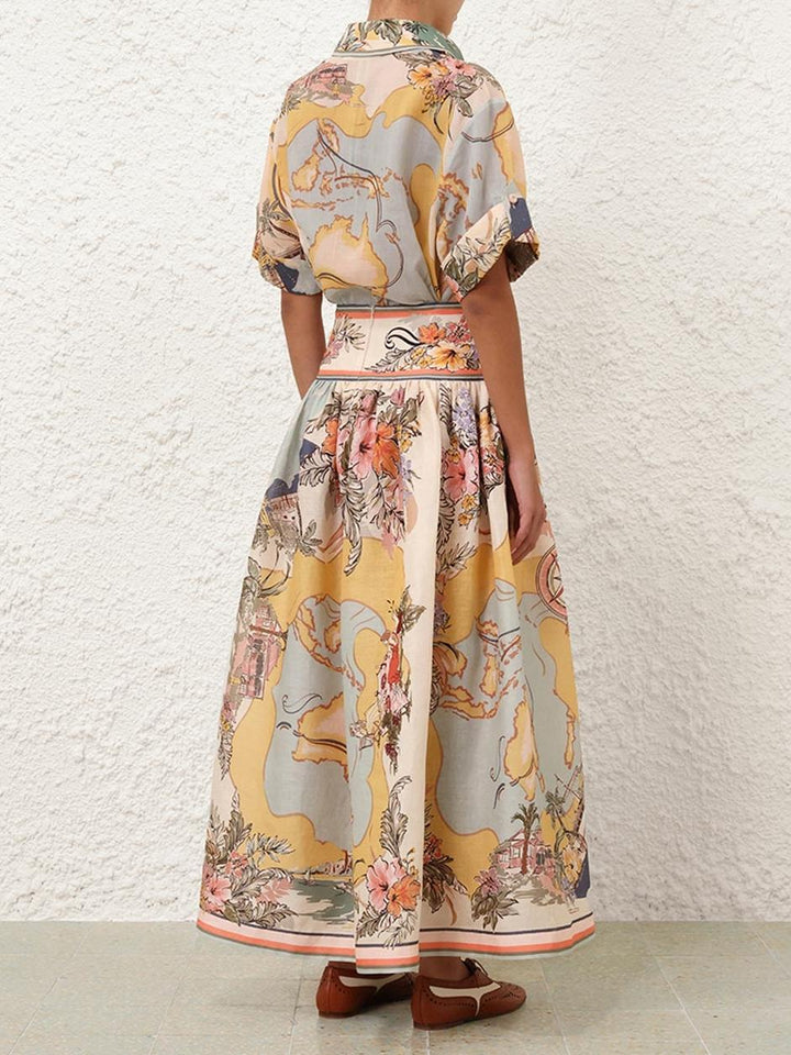 "Jupe midi Cindy élégante avec motifs floraux délicats pastel, charmante et féminine pour un look estival poétique."