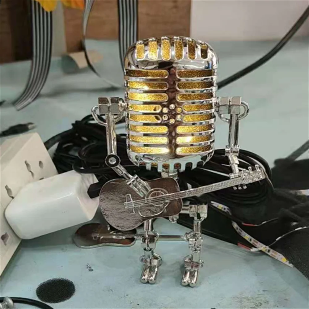 Lampe de table robot en métal avec guitare, design moderne, éclairage variable, idéale pour la décoration intérieure unique.