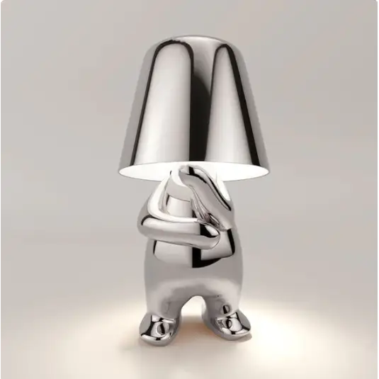 Lampe LED tactile or moderne, sans fil et rechargeable, design formes humaines, ambiance chaleureuse et décorative.