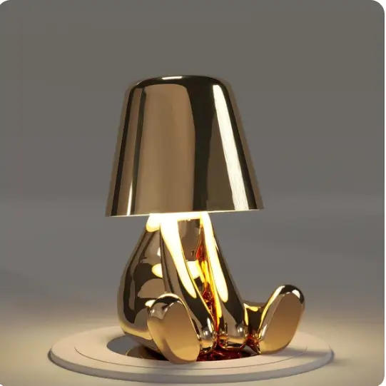 Lampe LED tactile or moderne, sans fil et rechargeable, design formes humaines, ambiance chaleureuse et décorative.