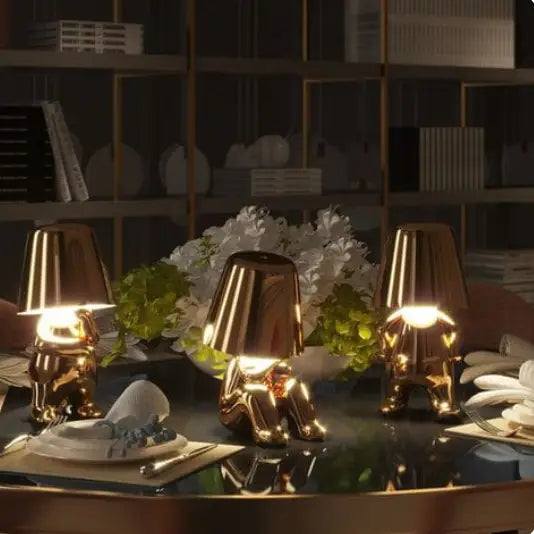 Lampe LED tactile or moderne, sans fil et rechargeable, design formes humaines, ambiance chaleureuse et décorative.