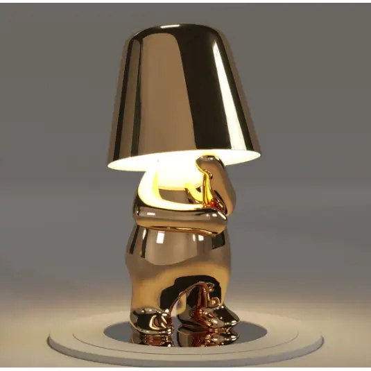Lampe LED tactile or moderne, sans fil et rechargeable, design formes humaines, ambiance chaleureuse et décorative.