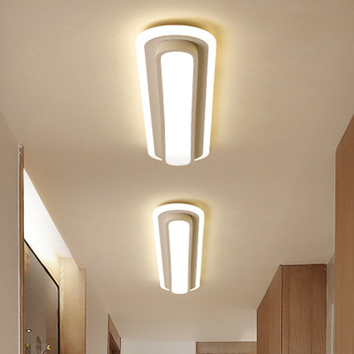 Lampe plafond ovale LED noir et blanc moderne, design épuré, diffuseur acrylique, élégance contemporaine pour intérieur.