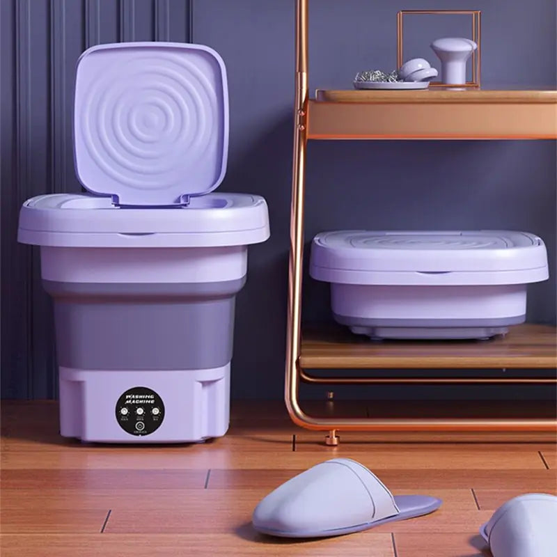 Machine à laver portable pliable. Lavage efficace et compact, idéal pour petits espaces. Gain de place garanti.