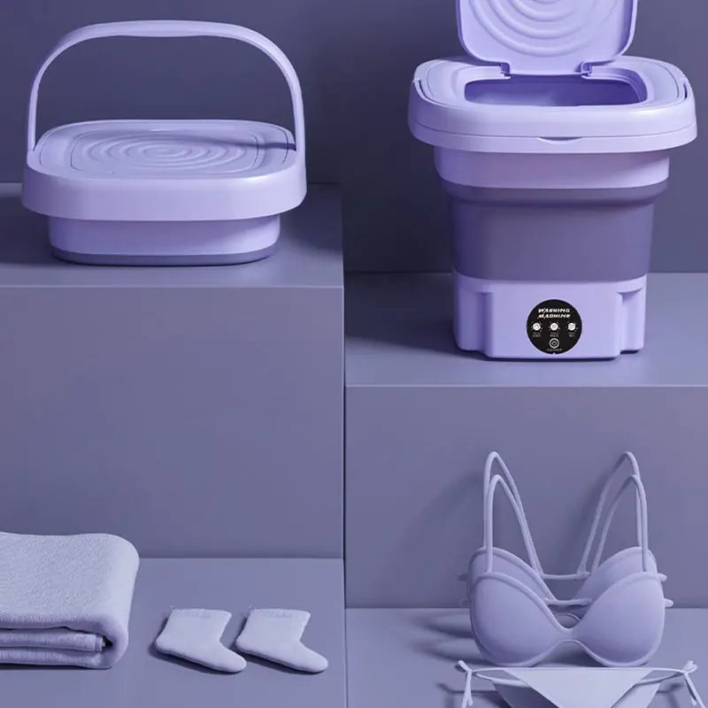 Machine à laver portable pliable. Lavage efficace et compact, idéal pour petits espaces. Gain de place garanti.