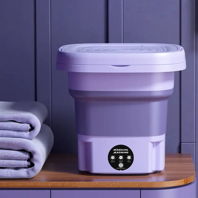 Machine à laver portable pliable. Lavage efficace et compact, idéal pour petits espaces. Gain de place garanti.