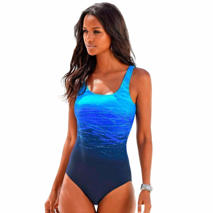 Maillot de bain femme une pièce stylé, parfait pour la piscine, la plage et les activités aquatiques.
