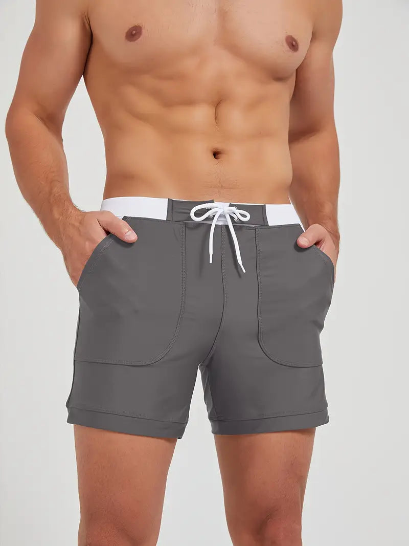 "Maillot de bain homme, séchage rapide, design moderne et élégant, couleur vive, parfait pour plage ou piscine."
