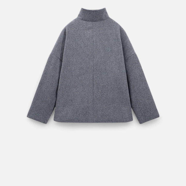 Manteau hiver femme élégant, coupe ample, double boutonnage, confort et style.