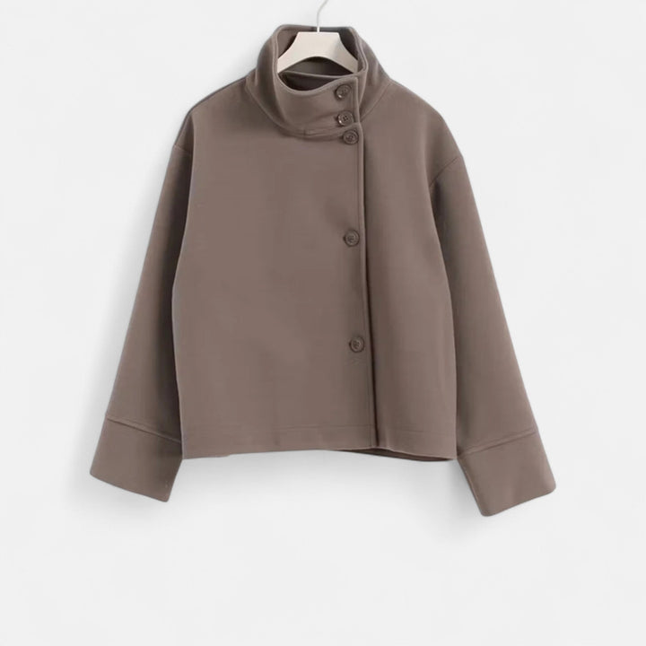 Veste chic femme double boutonnage, coupe ample, style moderne et raffiné.