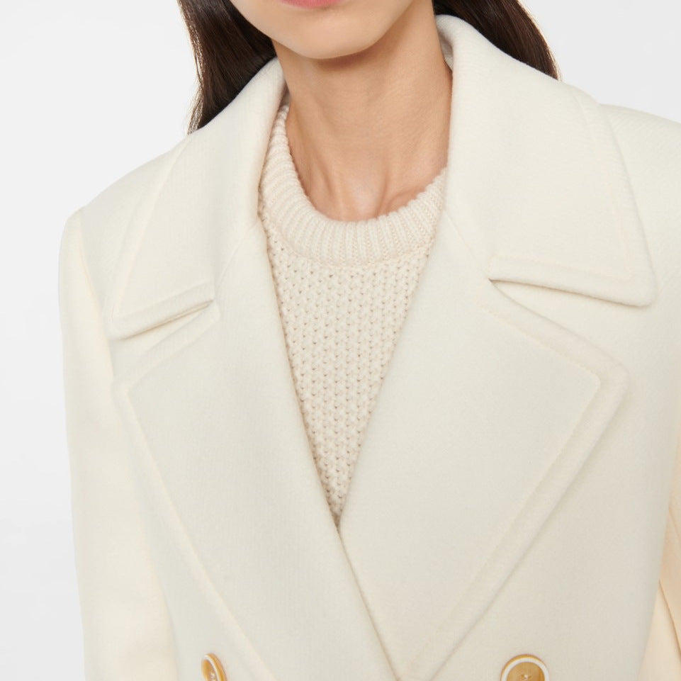 Manteau femme long et sophistiqué, style croisé intemporel. Parfait pour l'automne et l'hiver.