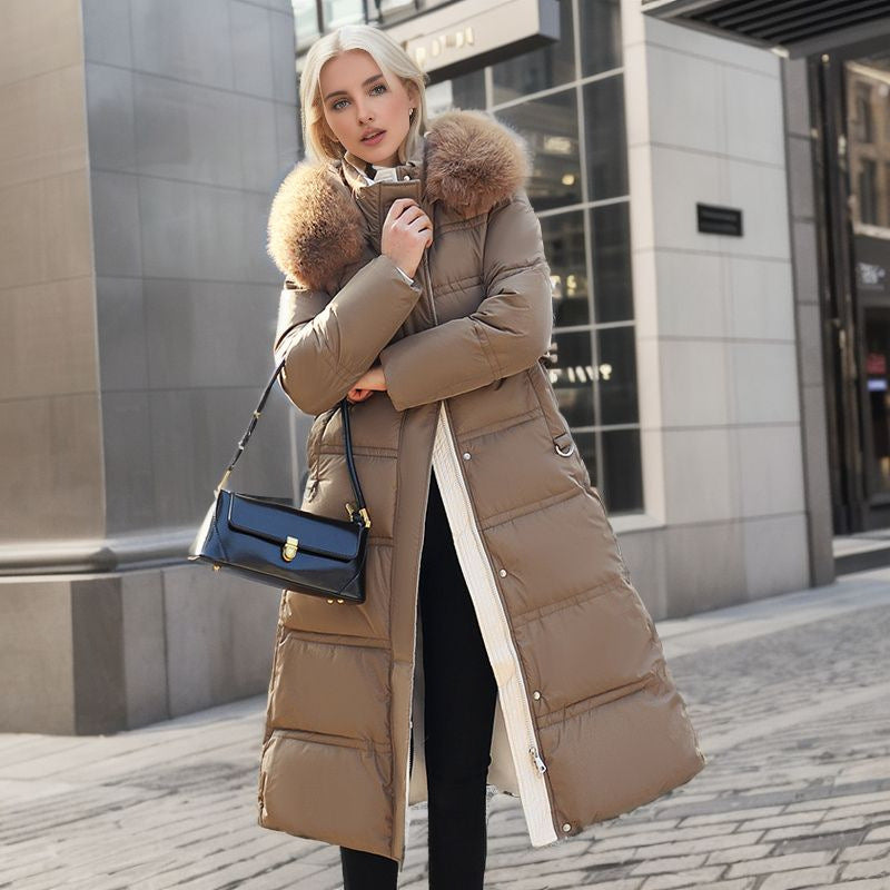 Veste matelassée longue femme, col fourrure, idéale protection hivernale contre le froid et tendance.