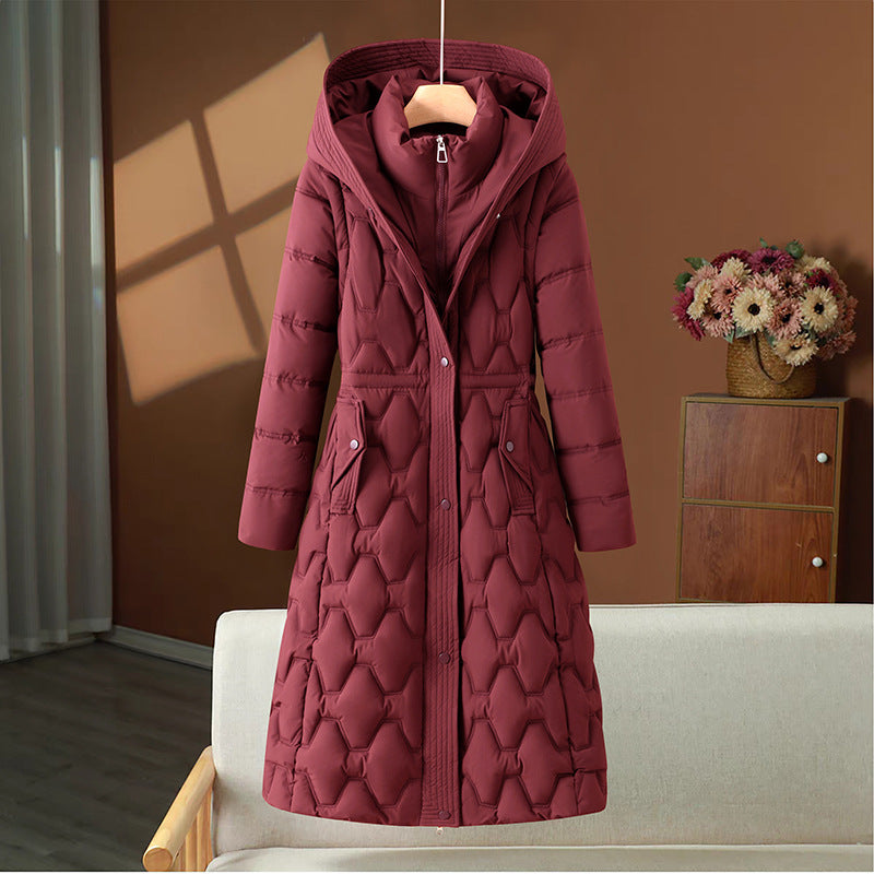 Veste longue matelassée pour femme, très chaude et élégante, idéale pour affronter le froid.