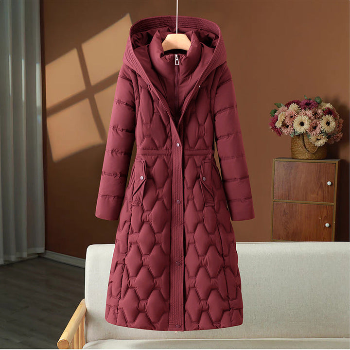 Veste longue matelassée pour femme, très chaude et élégante, idéale pour affronter le froid.