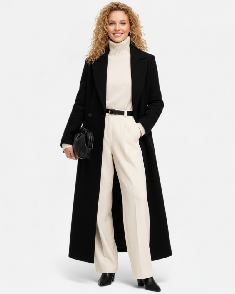 Manteau long noir élégant pour femme, style chic et intemporel. Idéal pour l'hiver, l'automne ou la mi-saison.