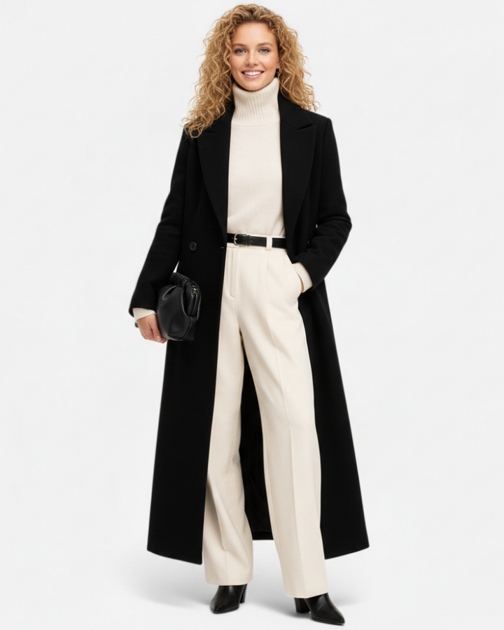 Manteau long noir élégant pour femme, style chic et intemporel. Idéal pour l'hiver, l'automne ou la mi-saison.