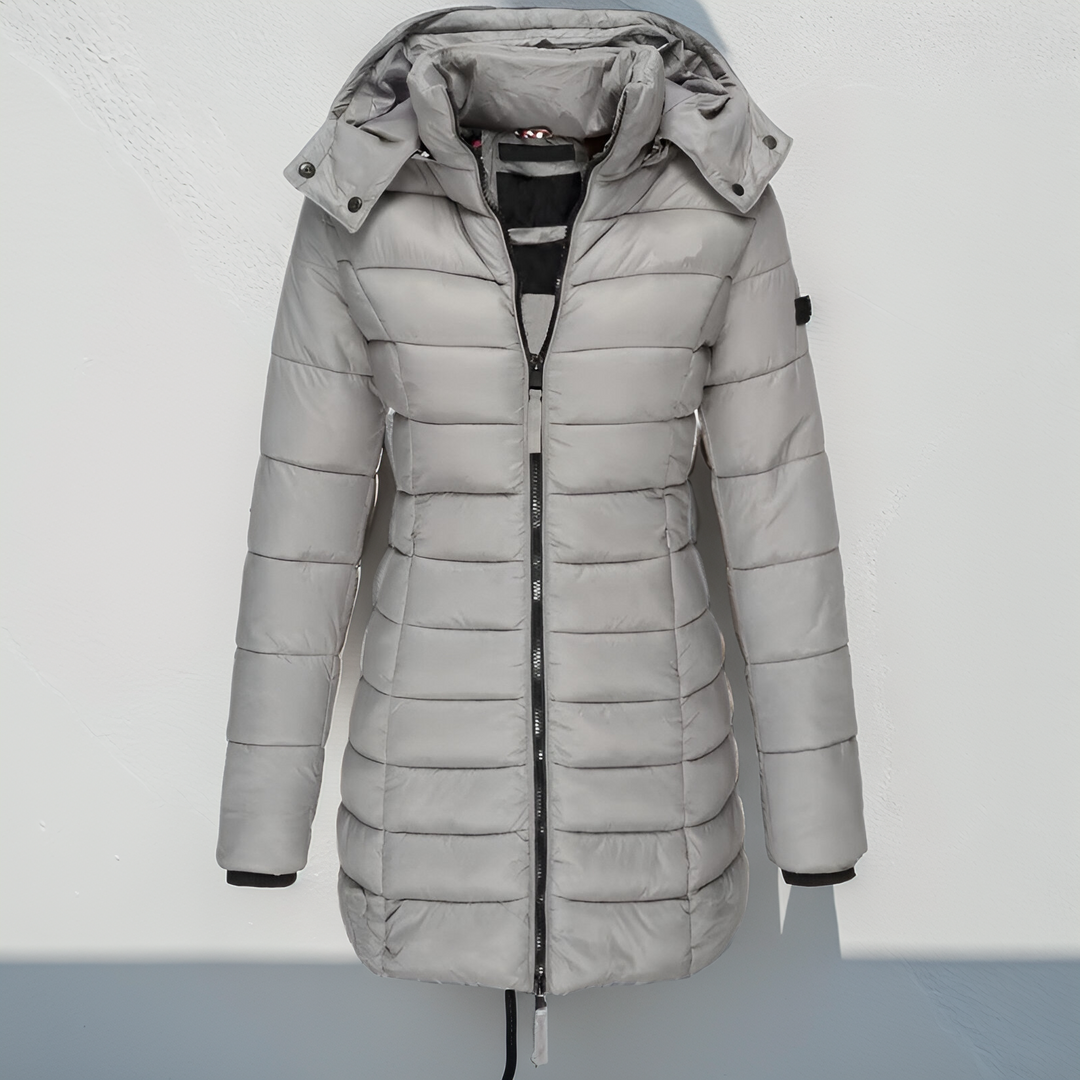 Élégant manteau long femme, rembourré et déperlant. Parfait pour l'automne et l'hiver. Veste tendance.