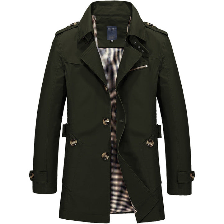 "Manteau trench homme élégant avec coupe structurée, doublure lisse, épaulettes marquées et style croisé sophistiqué."