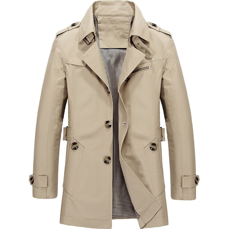 "Manteau trench homme élégant avec coupe structurée, doublure lisse, épaulettes marquées et style croisé sophistiqué."
