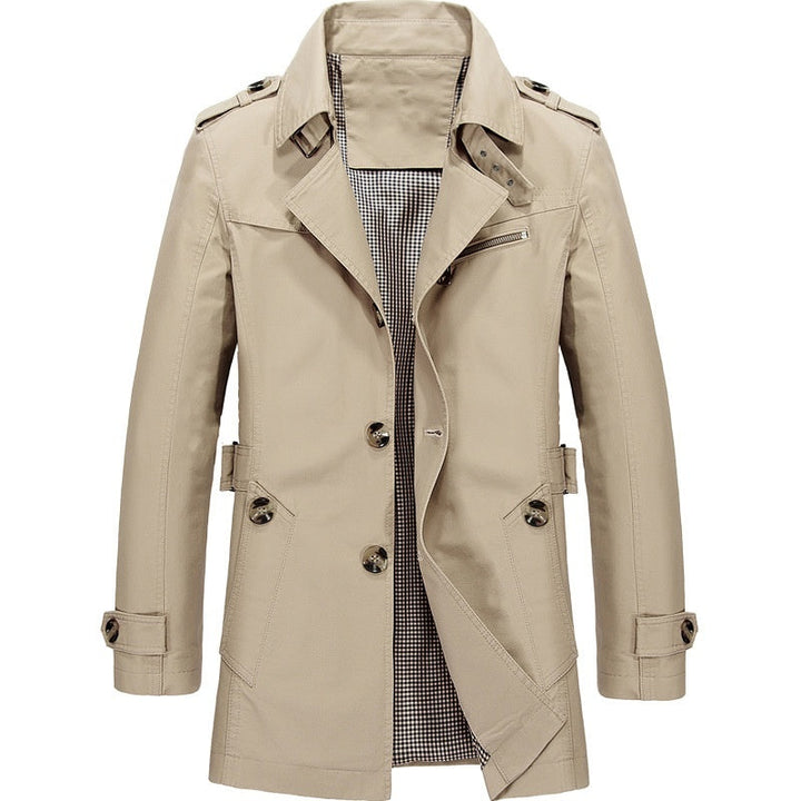 "Manteau trench homme élégant avec coupe structurée, doublure lisse, épaulettes marquées et style croisé sophistiqué."